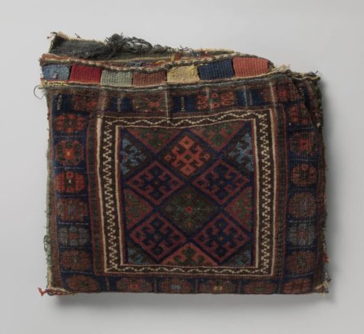 Saddlebag decorated with lattice work containing cross flowers