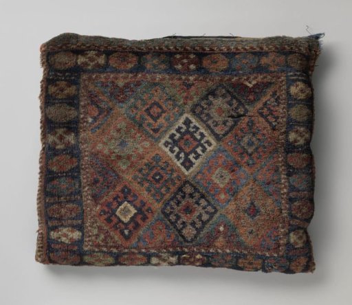 Front panel of a saddlebag, decorated with lattice work with hooked cross-flowers