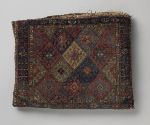 Saddlebag, decorated with lattice work featuring hooked cross flowers