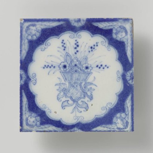 Tile with a basket of flowers on a console and carved angel heads in the corners.
