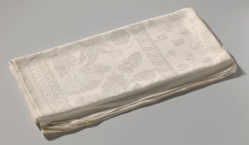 Tablecloth of white linen damask with a floral pattern
