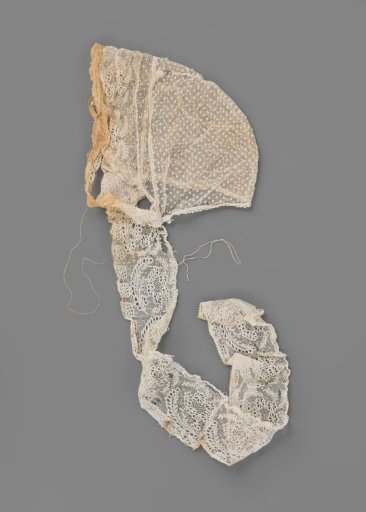 Tulle Hat with Lace from Rijs; the Crown of Embroidered Tulle is Trimmed Along the Forehead with a Strip of Lace from Rijs, Which Extends into Chin Straps