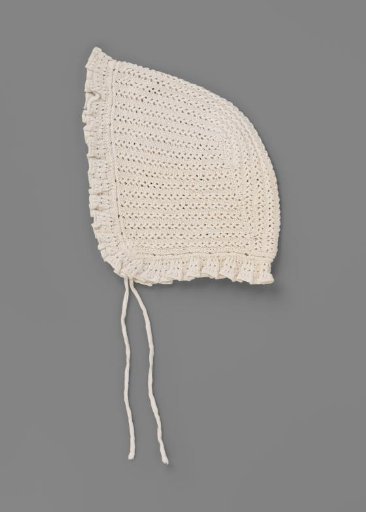 Cap for day or underdress of knitted cotton; with pleated and scalloped edge