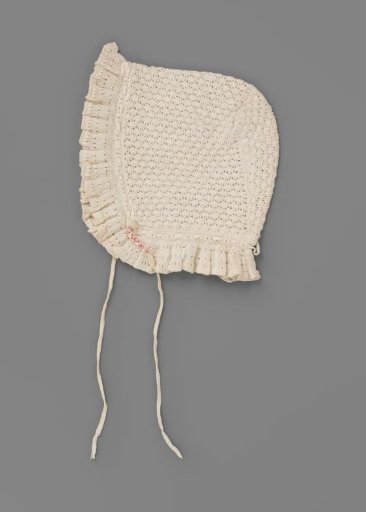 Cap for day or underdress with a bobbin of crocheted cotton and a strip of knitted cotton
