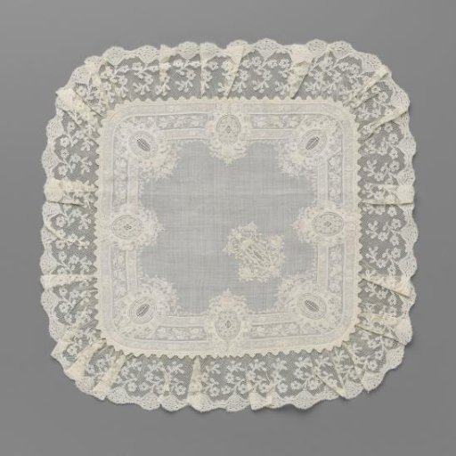 Handkerchief of batiste with embroidery of eight richly decorated medallions along the edges and a richly decorated letter T