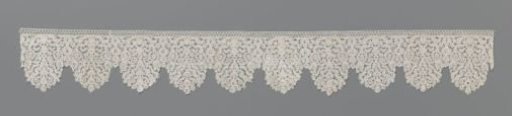 Strip of bobbin lace with thistle in flowerpot
