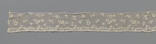 Strip of needle lace with floral scatter pattern and pointed oval motifs