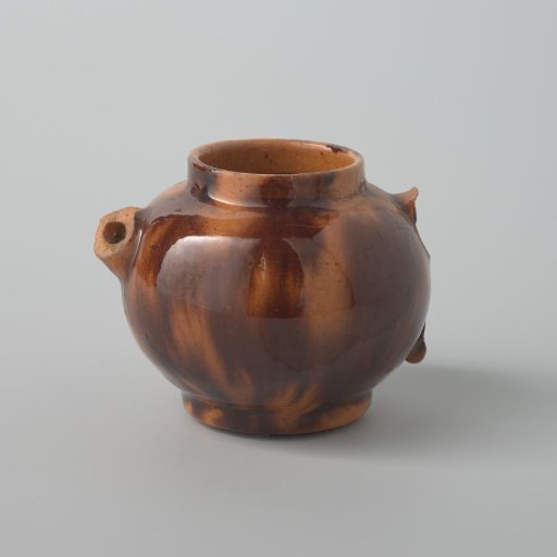 Earthenware teapot with a yellow glaze and brown spots (De Caluwe kiln waste)