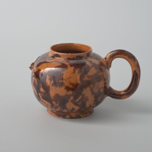 Teapot of earthenware with a yellow glaze and brown spots (De Caluwe kiln waste)