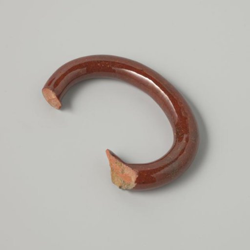 Ear of a teapot with deep orange glaze (De Caluwe kiln waste)