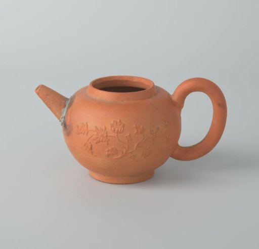 Teapot of unglazed earthenware with floral branches in relief (De Caluwe kiln waste)