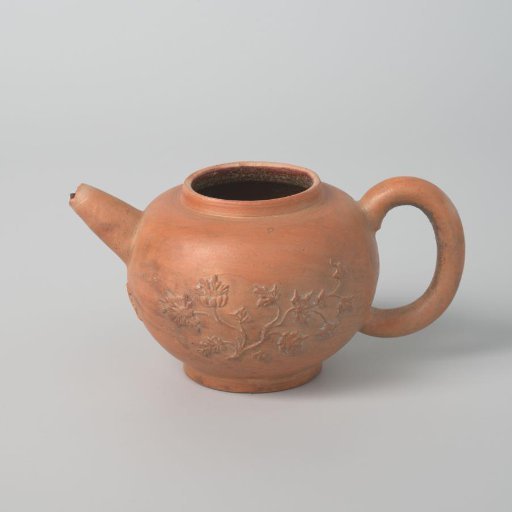 Teapot with flower branches in relief (De Caluwe bakafval)