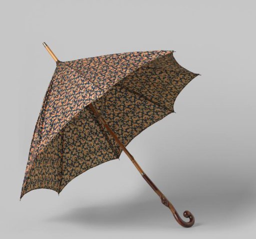 Parasol with a cover of dark blue printed cotton featuring red and natural-colored half-moons and branches, on a bamboo and wood stick
