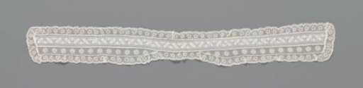 Bow tie for a lady of batiste with plumetis embroidery and with an insert and a border of machine-made Valenciennes lace