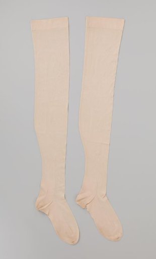 Stocking of plain ivory-colored silk with a single embroidered arrow on the seam