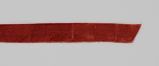 Ribbon of red velvet, consisting of three pieces of ribbon sewn together