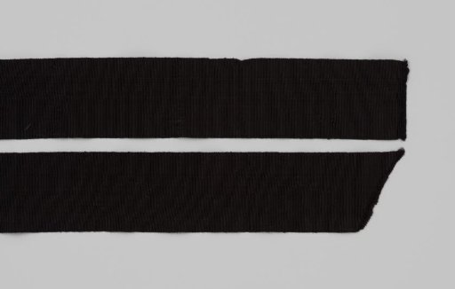 Two pieces of black taffeta ribbon