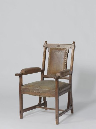 Armchair with brown leather upholstery
