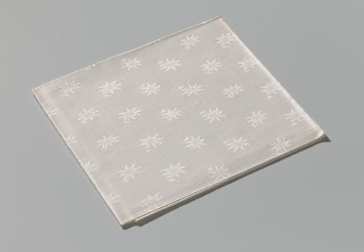 Napkin of linen damask with a floral pattern