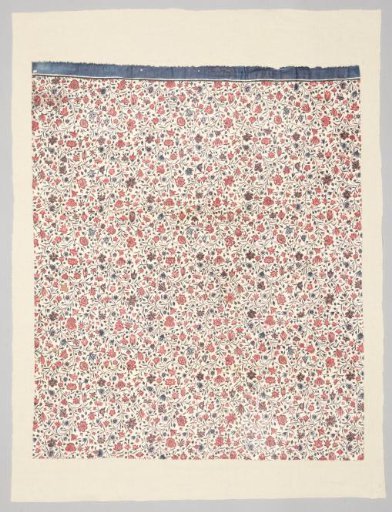 Fragment of a chair seat with a pattern of twigs with small flowers