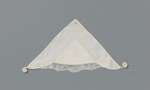 Linen tablecloth with a strip of bobbin lace with a scalloped edge with four-leaf rosettes