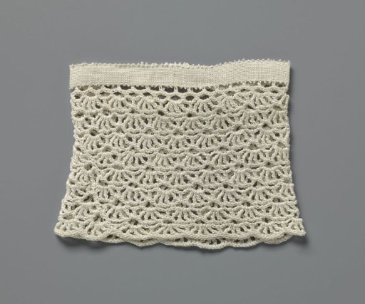 Cuff of crochet work with fan motif