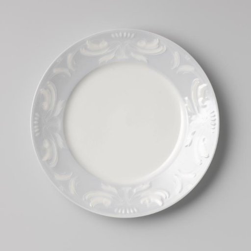 Dessert plate with symmetrical leaf motifs in relief