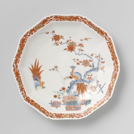 Saucer with flowering plants near fences and birds