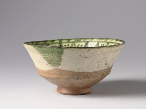 Bowl with diaper and scroll patterns in green on a white slip