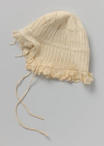 Knitted Child's Cap of White Cotton, Decorated with Horizontal Stripes and Openwork Stripes, Flower Motif and Laced Cord
