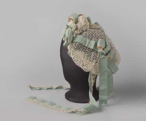 Bonnet-coiffure or matron's cap of lace with blue ribbon