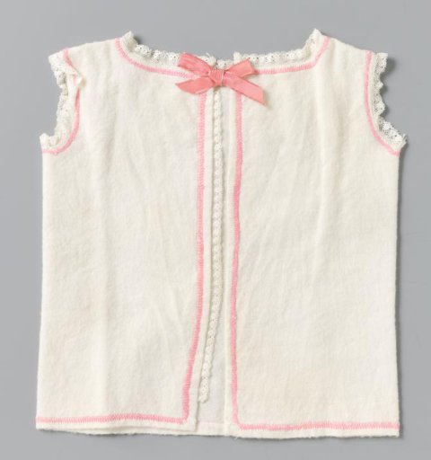 Baby shirt of white flannel with a border in pink flannel stitch and pink ribbon; decorated with Valenciennes lace in the armholes