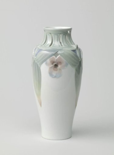Vase of porcelain, decorated in pâte-sur-pâte with leaves and flowers