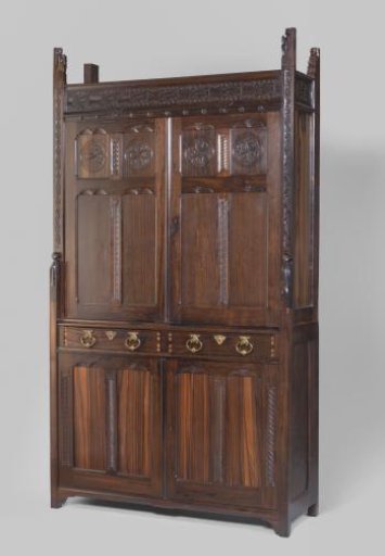 Cabinet consisting of a lower cabinet and a light recessed upper cabinet with corner posts ending in carved figures