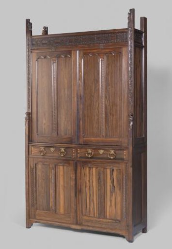 Cabinet consisting of a lower cabinet and a light recessed upper cabinet with corner posts ending in carved figures