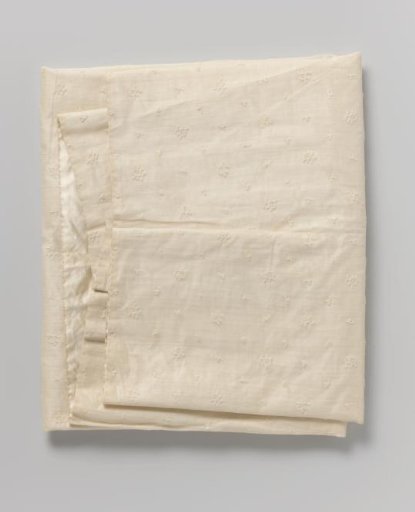 Baby carrier of white linen batiste with white tambour embroidery on white satin, with a scattered pattern of berries and commas