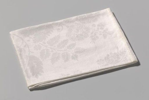 Linen damask napkin with a lace pattern
