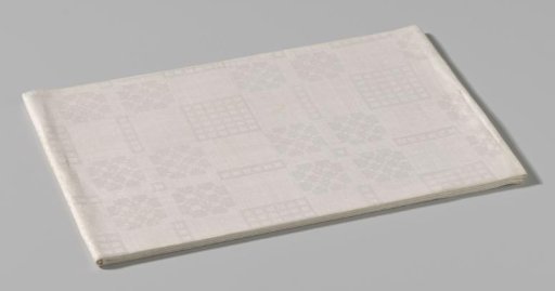 Tablecloth with a pattern of scales, waffle check and flower shape