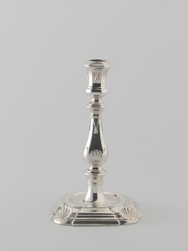 Candelabrum on a square base with indented, rounded corners decorated with shells
