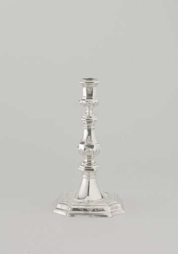 Silver candelabrum with octagonal foot and octagonal baluster-shaped stem with candle holder. Engraved with rocaille motifs.