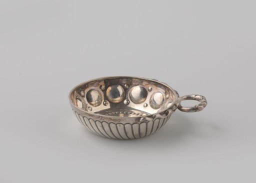 Silver tasting spoon with a convex vaulted wall. Decorated with knobs and balls.