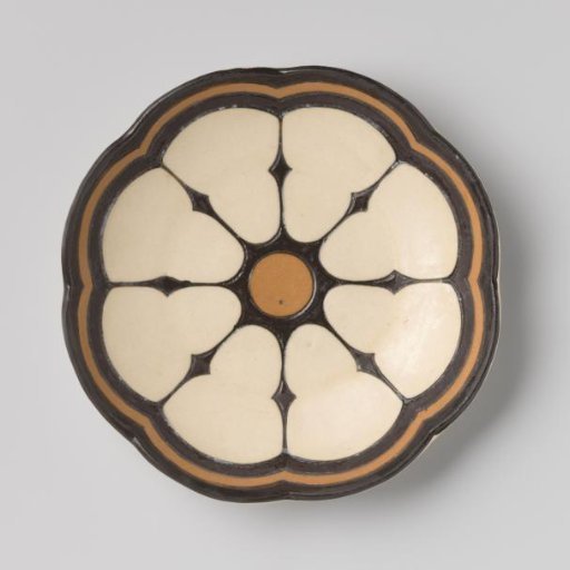 Plate decorated with a design in black and brown