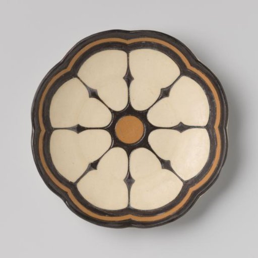 Plate decorated with a design in black and brown