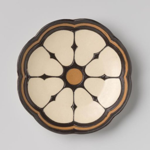 Plate decorated with a design in black and brown