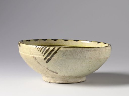 Bowl with stylized flowering plants and scrolls