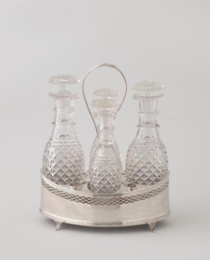 Bottle with stopper belonging to an oil and vinegar set consisting of four bottles in a pointed oval holder