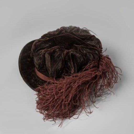 Hat of brown velvet chiffon decorated with checks of velvet ribbon filled with ostrich feathers