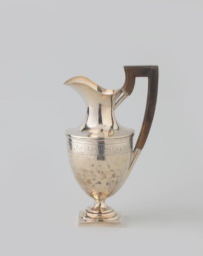 Silver tankard, round on square, straight-sided base. Decorated with meander border. Handle of wood