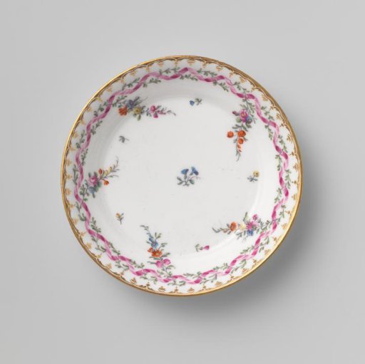 Dish, painted with a zigzag ribbon, around which a branch with leaves winds