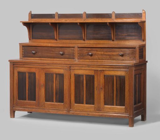 Buffet with a recessed upper section containing two drawers and a shelf, decorated with carved fruit and stylized foliage